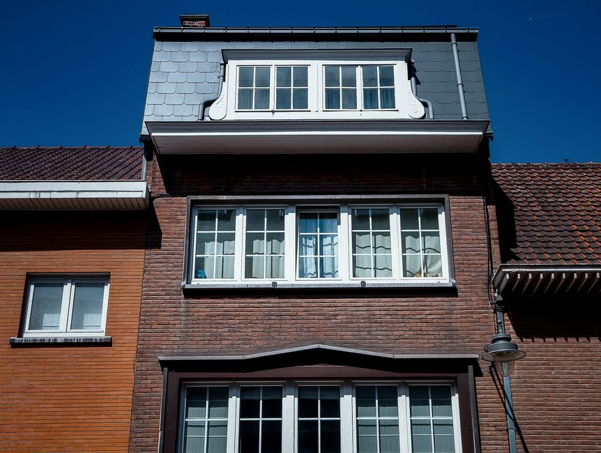 A bay or casement window seen from outside on a residential home